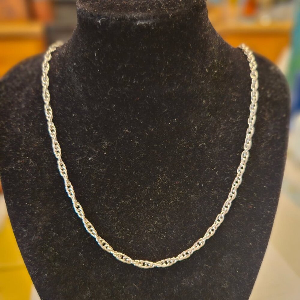 Silver toned twisted herringbone chain necklace 24 inches with a barrel clasp